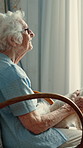 Old woman, window and thinking with dog in home for vision, memory and relax in rocking chair. Senior person, puppy and animal pet in house for retirement, peace and reflection for ideas and memories