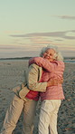 Beach, old women and hug on break in nature, retirement and happy for reunion on peaceful adventure. Outdoor, friends and elderly people with smile on summer vacation, space and dancing on getaway