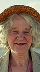Travel, face and old woman outdoor with greeting, senior holiday and fresh air on weekend break. Wind, happiness and elderly person with friendly nod, retirement vacation and getaway in New Zealand.