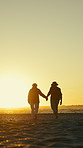 Walking, sunset and old people holding hands on beach, retirement tourism and windy travel holiday. Mockup space, back and senior women with friends vacation trip for bonding, sea breeze and flare