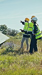 Group, engineer and inspection with solar panels in field for renewable energy, electricity and sustainability. Team, people and photovoltaic farm for maintenance, eco friendly power system and grid
