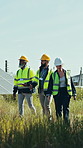 Team, engineer and inspection with solar panels in field for renewable energy, electricity and sustainability. Group, people and photovoltaic farm for maintenance, eco friendly power system and grid