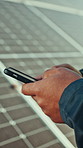 Person, hands and technician with phone for solar panel installlation, software or testing app. Engineer, typing and mobile smartphone with alternative energy or power for eco friendly development
