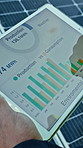 Person, hands or tablet screen with solar panel for photovoltaic system, statistics or review. Closeup, analyst and scrolling with technology display, graph or chart for renewable energy or power app