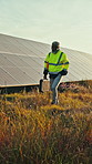 Engineer, walk and inspection with solar panels in field for renewable energy, electricity and sustainability. Mature, man and photovoltaic farm for maintenance, eco friendly power system and sunset