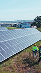 Drone, people and solar panel outdoor on farm for renewable energy, collaboration or engineering. Aerial, agriculture team and meeting with photovoltaic system, sustainability or eco friendly project