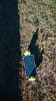 Solar panels, drone or engineering with men in nature for photovoltaic grid, renewable energy or install. Sustainability, electric system or teamwork with safety, industry or outdoor for maintenance