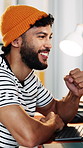 Celebrate, fist pump and man with smile in creative agency, ads engagement goal and campaign success. Reading, achievement and marketer with good news for project, winner and target audience increase