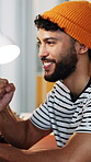 Reading, fist pump and man with smile in creative agency, ads engagement goal and campaign success. Celebrate, achievement and marketer with good news for project, winner and target audience increase