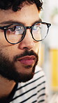 Glasses, creative and man in office, reading and research for news report, submission and deadline. Person, copywriting and journalist in workplace, reflection and eyewear for clear vision and ideas