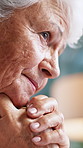Wedding ring, nostalgia and senior woman in home with thinking, memory or loneliness in living room. Sad, reflection and elderly female person with marriage jewelry for grief with daydreaming.