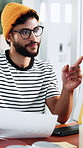 Businessman, documents and pointing with computer for performance review or analysis in office. Man, analyst or employee with paperwork, graph or chart for statistics or project data in workplace