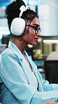 Headphones, reading and woman with programming in office, planning app update and streaming music. Listening, audio tech and happy developer with idea for software maintenance, radio or system review