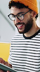 Reading, man and tablet in office with smile, article planning and research with source. Journalist, male person and creative agency with glasses for networking, story feedback and project update