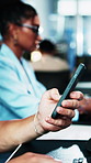 Phone, swipe and hands of businessperson in office with texting, networking or communication on app. Technology, scrolling and employee on cellphone for email, contact or connectivity in workplace.