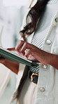 Woman, hands and typing in office with tablet, review online project and website for digital marketing. Creative, person and scroll in workplace with tech, research and plan for advertising campaign.