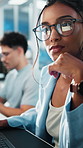 Woman, glasses and reading in office with computer, news report and investigation for online article. Coworking, writer and person in workplace with pc, review and typing story for media publication.