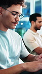 Glasses, programming and typing with man in workplace for firewall maintenance or system upgrade. Cybersecurity, eyewear and web development with programmer in coworking office for engineering