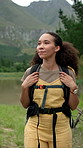 Woman, hiking and outdoor with backpack in nature for journey, adventure trip or travel. Female person, hiker and walking with bag, path or trail for sightseeing, trekking or expedition in wilderness