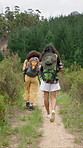 Backpacking, hiking and back of friends in nature with adventure, discovery or exploring on vacation. Point, outdoor and female people trekking for travel with health, wellness or bonding on holiday.