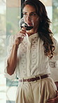 Thinking, window and woman with red wine in home to relax for weekend, good mood and chill. House, peaceful and mature person with alcohol, drink and glass for calm, reflection and daydreaming