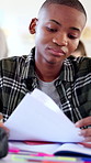 Education, paperwork and teen with worry in class, academic pressure and report with low exam marks. Student, thinking and boy with documents after quiz, sad and reading bad results in high school