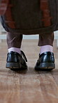 Anxiety, feet and student in high school for education, quiz stress and adhd for learning difficulty. Shoes, exam worry and teenager with nervous tapping for test, studying and space in classroom