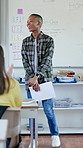 Classroom, presentation and applause with boy for development, education or assessment. Public speaking, success or oral report with document for student, knowledge and speech exam for scholarship