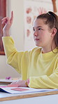 Teenager, girl and question in high school with raised hand, learning skills or participation for quiz. Student, query and knowledge in classroom with assessment, scholarship or academy for education