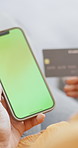 Hands, phone and credit card with green screen in home for online shopping, space and easy payment. Person, smartphone and blank ux with digital banking, mobile app and fintech for ecommerce in house