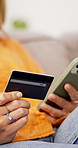 Hands, phone and credit card in home for online shopping, space and easy payment on sofa. Person, smartphone and budget with digital banking, mobile app and fintech for ecommerce on couch in house
