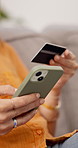 Hands, phone and credit card in home for ecommerce, space and easy payment on sofa. Person, smartphone and budget with digital banking, mobile app and fintech for online shopping on couch in house