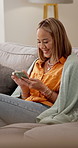 Typing, phone and woman on sofa laugh for social media, internet post and online notification. Home, scroll and girl on smartphone for message, website and mobile app for connection, contact and chat