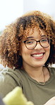 Happy woman, face and phone with texting on sofa, relax and glasses for online dating in home. Person, smile and smartphone in portrait on couch, mobile app or social network post at house in Brazil