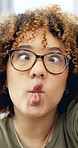 Woman, selfie and funny face in home with smile, playful and glasses for content creation on web. Person, influencer and blowing kiss with pout, peace sign and joke on social media at house in Brazil