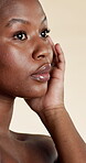 Beauty, skincare and glow with black woman in studio for facial, hydration and collagen. Shine, aesthetic and dermatology with female person on white background for  hygiene, clear skin and self care