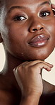 Beauty, hands and face with black woman in studio for skincare, hydration and glow. Shine, aesthetic and dermatology with portrait of person on white background for  hygiene, clear skin and self care