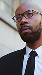 Serious, black man and lawyer walking with glasses in city for court case or ready for testimony. Male person, attorney or legal advisor with vision or ambition in urban town for business or justice