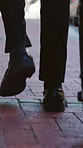 Back, walking and man in city, suitcase and travel for appointment, lawyer and opportunity. Closeup, attorney and person in street, luggage and movement for steps, journey and adventure in New York