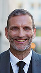 Happy, outdoor and face of businessman in city with confidence for finance career growth. Smile, professional and portrait of mature financial manager with pride for corporate job opportunity in town