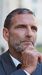 Lawyer, thinking and man in city, decision for court case results and reflection for opportunity. Mindset, mature person or attorney in street, professional and contemplation for strategy or solution