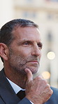 Lawyer, planning and man in city, decision for court case results and reflection for opportunity. Mindset, mature person or attorney in street, thinking and contemplation for strategy or solution