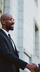 Businessman, meeting and handshake with greeting in city for partnership, agreement or onboarding. Man, employees or colleagues shaking hands with b2b for teamwork, deal or introduction in urban town