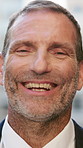 Laugh, outdoor and face of businessman in city with confidence for finance career growth. Happy, professional and portrait of mature financial manager with pride for corporate job opportunity in town