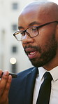 Black man, lawyer or talking with speaker phone in city for communication or negotiation. Male person, attorney or discussion with mobile smartphone for audio message, app or voice note in urban town