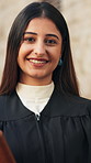 Happy, lawyer and face of woman in city with pride for legal career, confidence and opportunity. Professional, attorney and portrait of person by courthouse for trial, legislation and constitution 