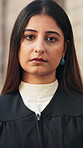 Serious, lawyer and face of woman in city with pride for legal career, case study and justice. Documents, attorney and portrait of person by courthouse for trial review, legislation and constitution 