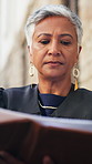 Judge, woman and paperwork in city for court case, review and insight in street with legal career. Mature person, magistrate and law professional with folder, legislation and justice with report