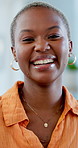 Face, smile and black woman in lounge, funny and relax with peace, confidence and positive attitude. Happy, laugh and African person in home, calm morning and satisfaction for weekend break and pride