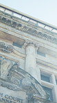 Law, building and court of justice in city for jurisdiction, constitutional legislation and flare. Low angle, architecture and courthouse outdoor for legal judgement, prosecution and civil matters